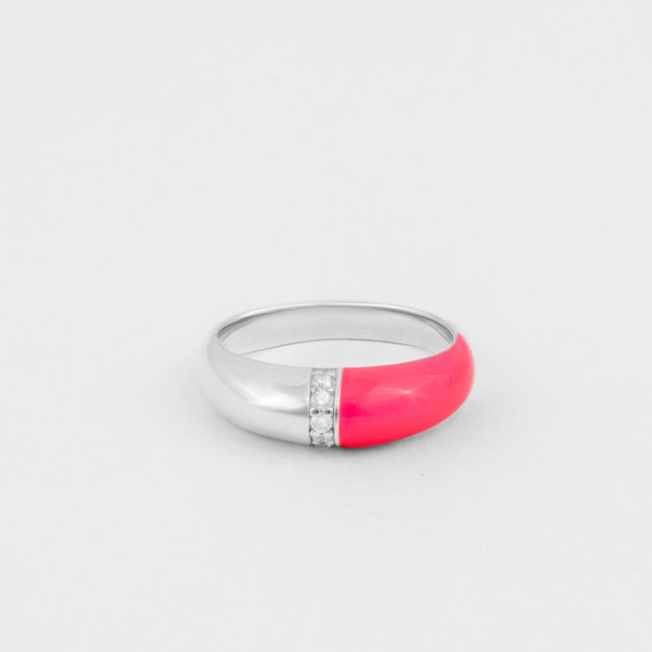 Hand-enameled 925 sterling silver dome ring with neon pink enamel and round-cut crystals. Produced in Italy. Réveli