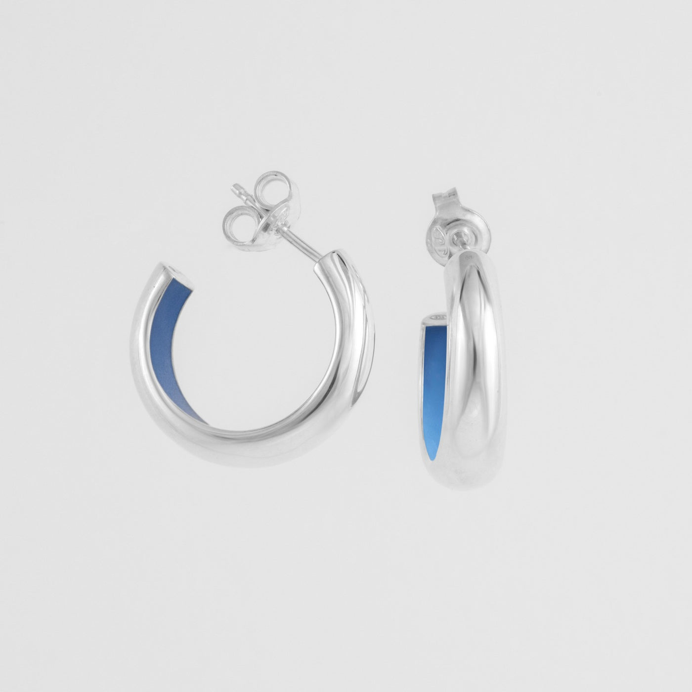 Hand-enameled 925 sterling silver light blue dome earrings. Produced in Italy . Réveli