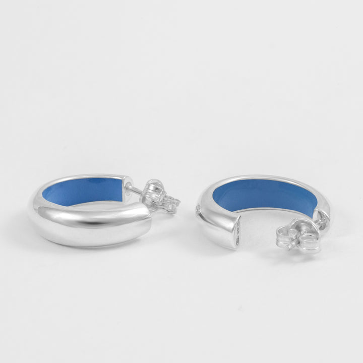 Hand-enameled 925 sterling silver light blue dome earrings. Produced in Italy . Réveli