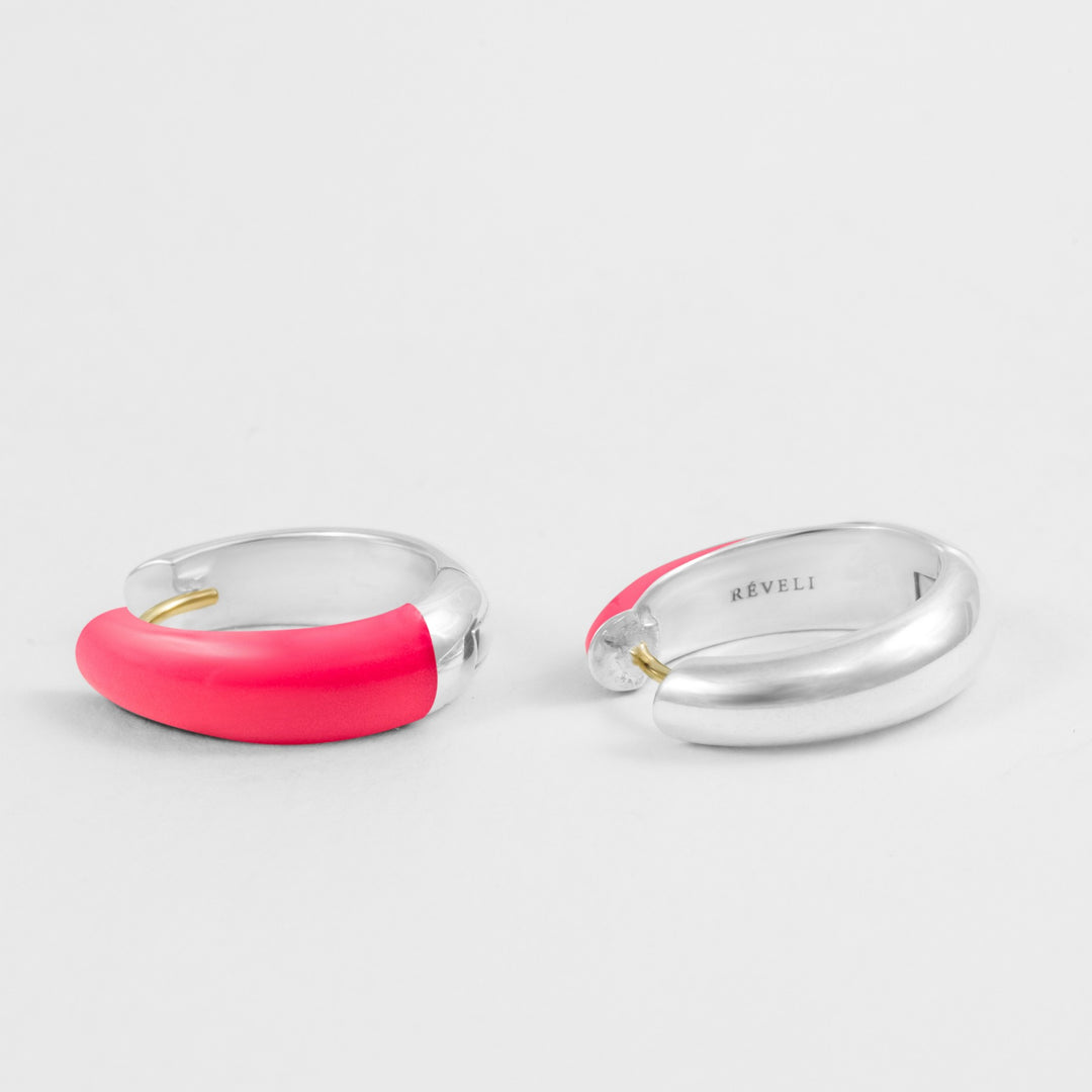 Hand-enameled oval dome earrings in 18K gold and 925 sterling silver and neon pink enamel. Produced in Italy. Réveli