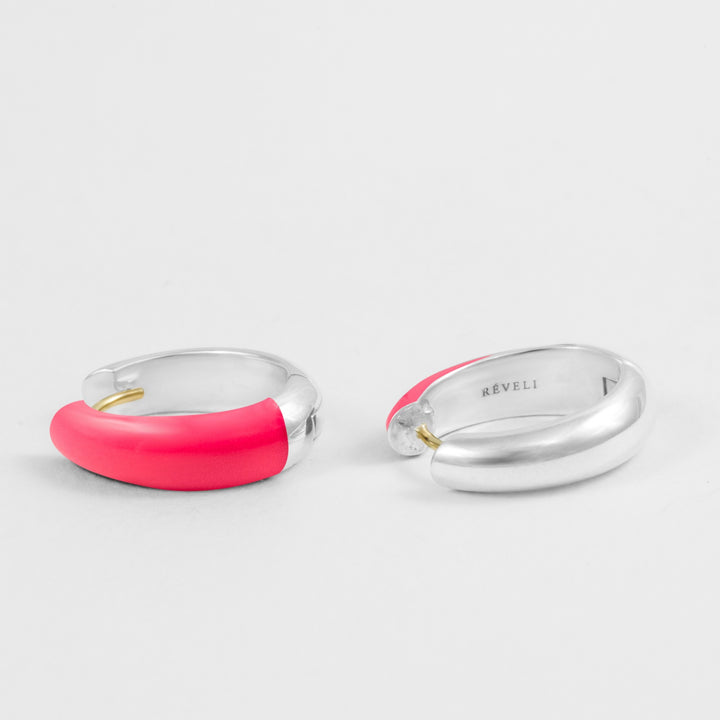 Hand-enameled oval dome earrings in 18K gold and 925 sterling silver and neon pink enamel. Produced in Italy. Réveli