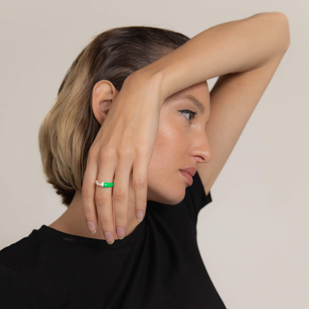 Hand-enameled 925 sterling silver dome ring with neon green enamel and round-cut crystals. Produced in Italy. Réveli